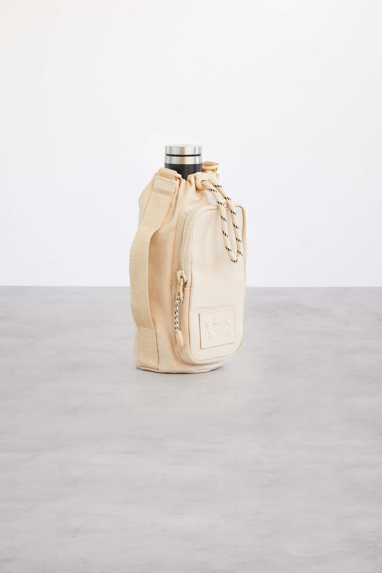 Resale The Water Bottle Sling in Beige